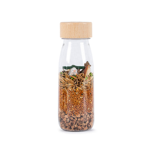 Bouteille sensorielle Savane avec graines et perles marron, bouchon en bois