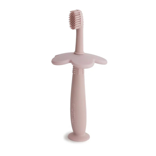 Brosse à dent de dentition en silicone rose avec poignée ergonomique pour bébé