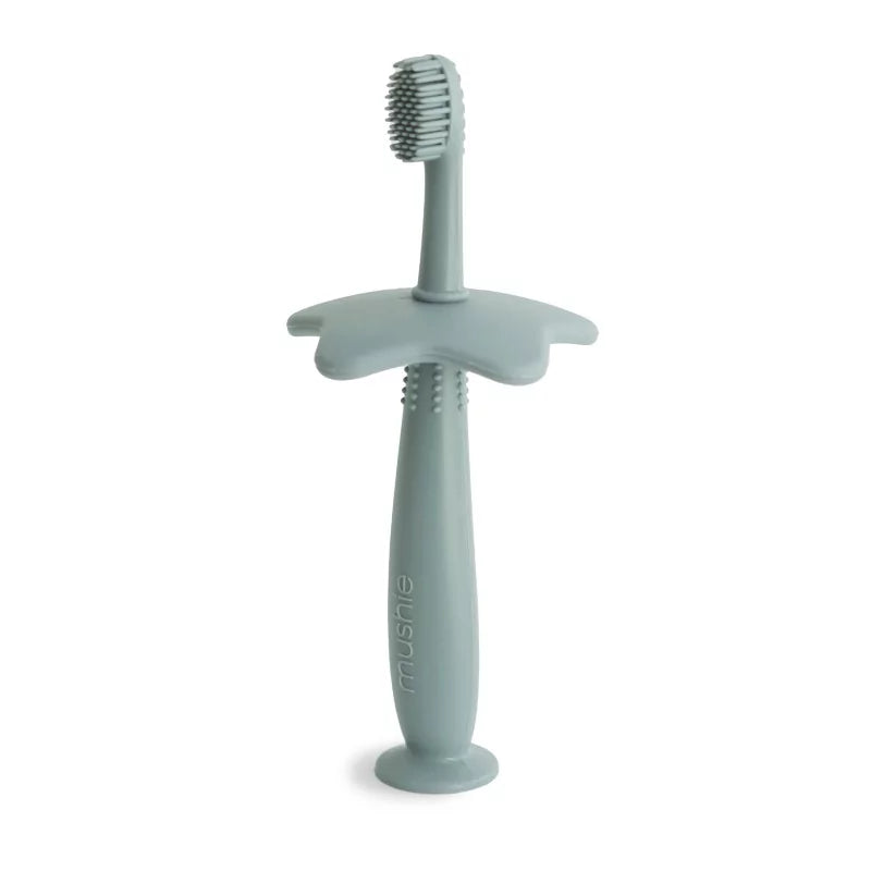 Brosse à dent de dentition en silicone vert sauge avec poignée ergonomique pour bébé