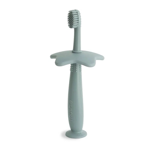 Brosse à dent de dentition en silicone vert sauge avec poignée ergonomique pour bébé