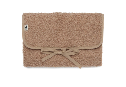 Tapis à langer nomade en tissu bouclette biscuit, plié avec liens